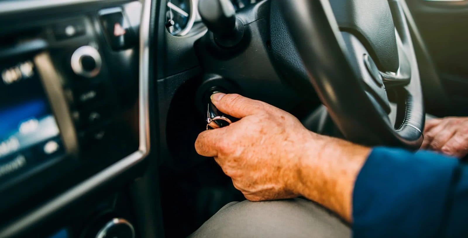 Key being turned in a car ignition