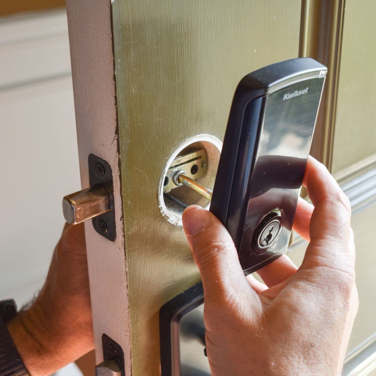 Smart lock being fitted to a timber door