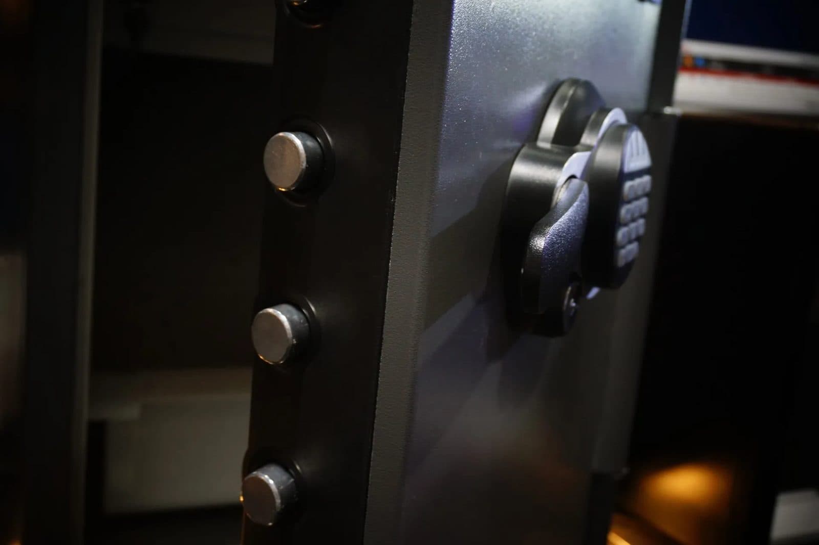 Keypad on a heavy safe door in low light